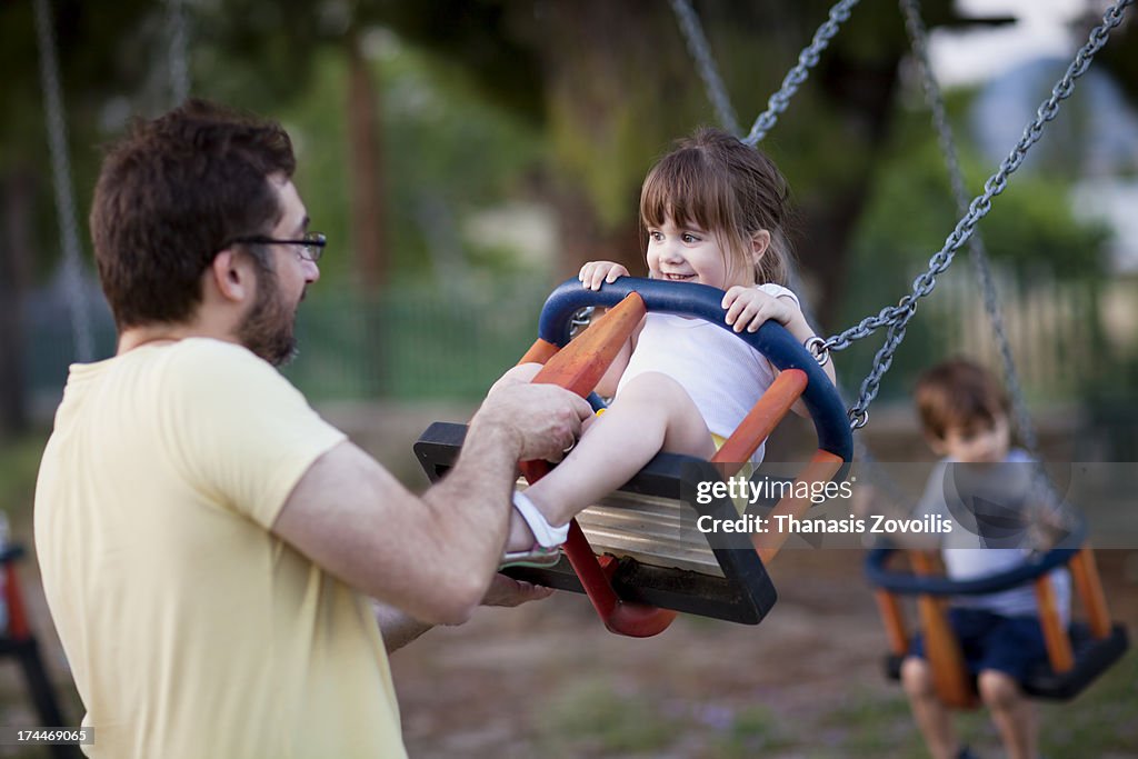 Father playing with his kids