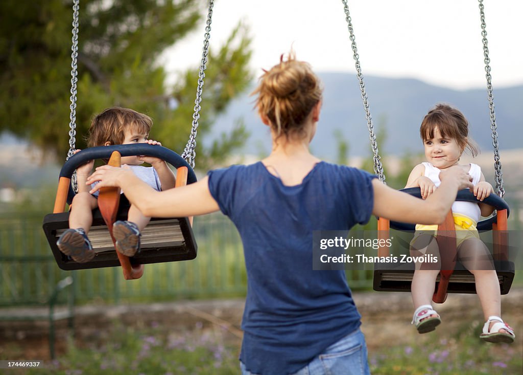 Mother with her kids in a playground