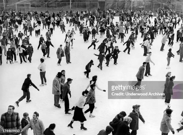Ice skaters throng to the Park for skating fun on a winter's day at Wollman Rink, in Manhattan's Central Park, New York, February 1957.
