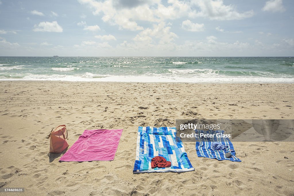 Towels and a bag at the beach