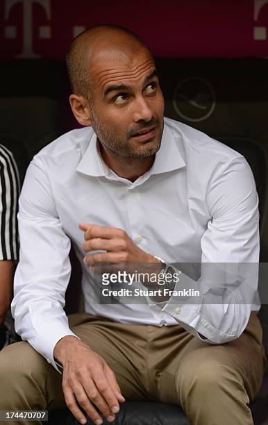 Josep Guardiola, head coach of Muenchen ponders during the Uli Hoeness cup match between FC Bayern Munich and FC Barcelona at Allianz Arena on July...