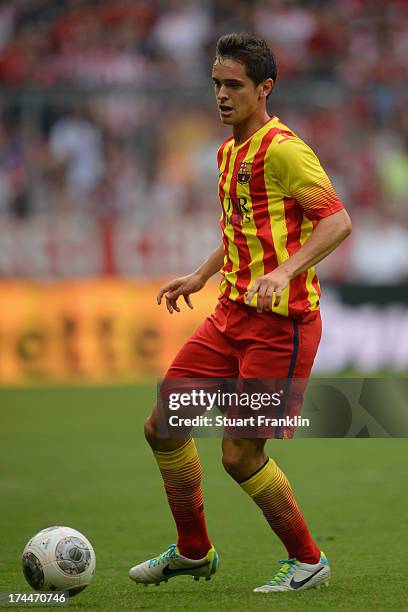 Jordi Quintilla of Barcelona in action during the Uli Hoeness cup match between FC Bayern Munich and FC Barcelona at Allianz Arena on July 24, 2013...