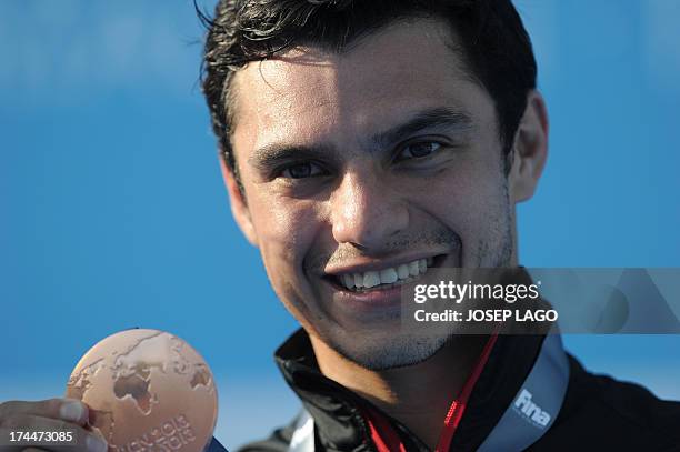 Bronze medallist Mexico's Yahel Castillo poses with his medal during the victory ceremony of the men's 3-metre springboard final diving event in the...