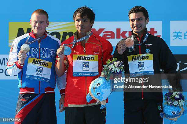 Silbver medal winner Evgeny Kuznetsov of Russia, Gold medal winner Chong He of China and Bronze medal winner Yahel Castillo of Mexico celebrate after...