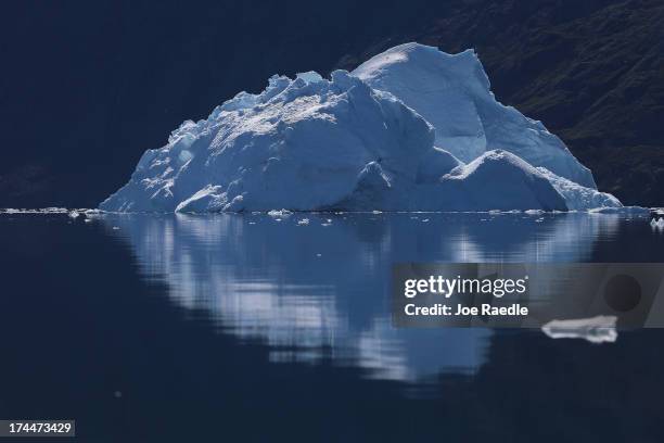 An iceberg floats through the water on July 21, 2013 in Ilulissat, Greenland. As the sea levels around the globe rise, researchers affilitated with...