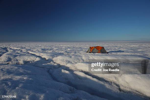 Tent is seen as scientists Sarah Das from the Woods Hole Oceanographic Institution and Ian Joughin of the University of Washington along with their...