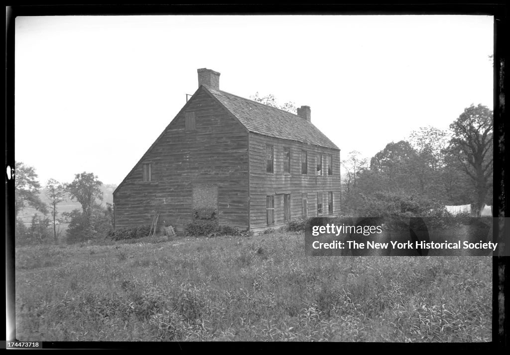 3/4 View Of Unidentified Large Saltbox House Set Near The Top Of A Hill