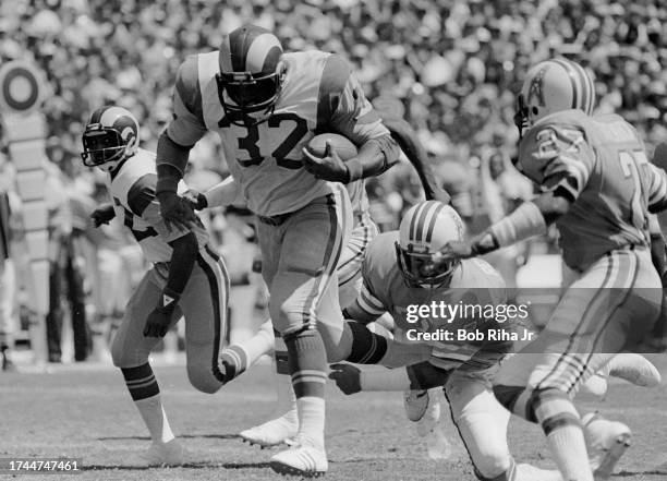 Los Angeles Rams Running Back Cullen Bryant sprints as Houston Oilers Mike Reinfeidt and Greg Stemrick attempt tackle during game action, September...