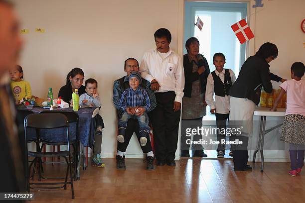 People attend a wedding party on July 20, 2013 in Qeqertaq, Greenland. As Greenlanders adapt to the changing climate and go on with their lives,...