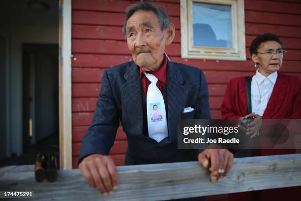 Inuk lange attends the wedding party of his granddaughter on July 20, 2013 in Qeqertaq, Greenland. As Greenlanders adapt to the changing climate and...