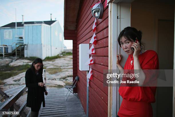 People gather for a wedding party on July 20, 2013 in Qeqertaq, Greenland. As Greenlanders adapt to the changing climate and go on with their lives,...