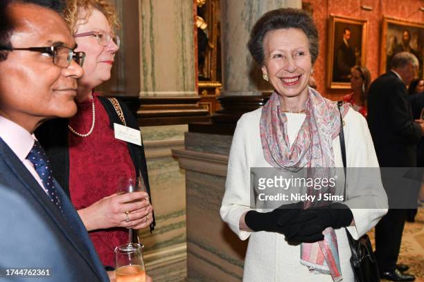 Anne, Princess Royal meets with personnel involved in the planning of Queen Elizabeth's funeral and the King's Coronation during a reception at...