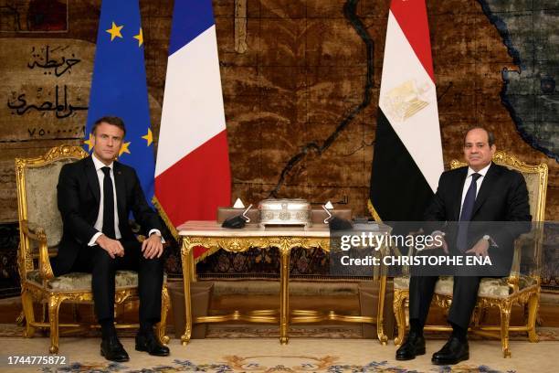 French President Emmanuel Macron and Egyptian President Abdel-Fattah al-Sisi pose before their talks in Cairo, on October 25, 2023. French President...