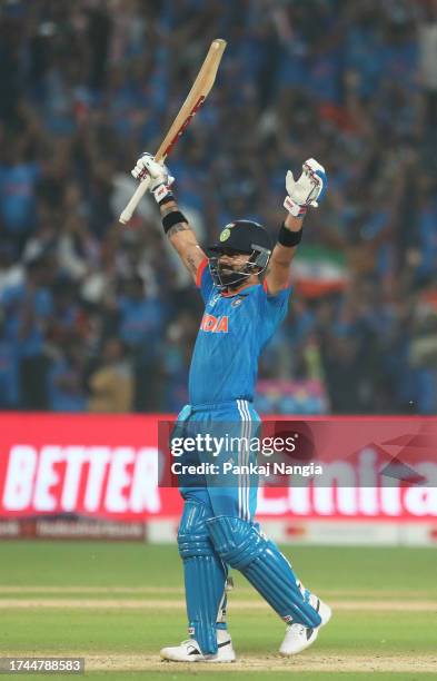 Virat Kohli of India celebrates their century as they hit the winning runs during the ICC Men's Cricket World Cup India 2023 between India and...