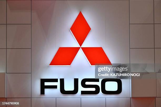 The logo of Mitsubishi Fuso Truck and Bus Corporation is seen during the press day of the Japan Mobility Show in Tokyo on October 25, 2023.