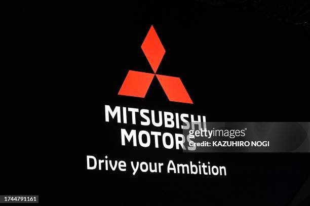 The logo of Mitsubishi Motors is seen during the press day of the Japan Mobility Show in Tokyo on October 25, 2023.