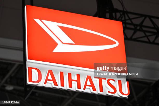 The logo of Japanese automaker Daihatsu is seen during the press day of the Japan Mobility Show in Tokyo on October 25, 2023.