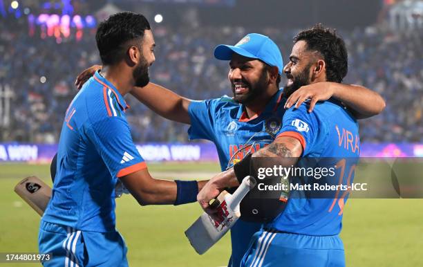 Virat Kohli, Rohit Sharma and KL Rahul of India celebrate following the ICC Men's Cricket World Cup India 2023 between India and Bangladesh at MCA...