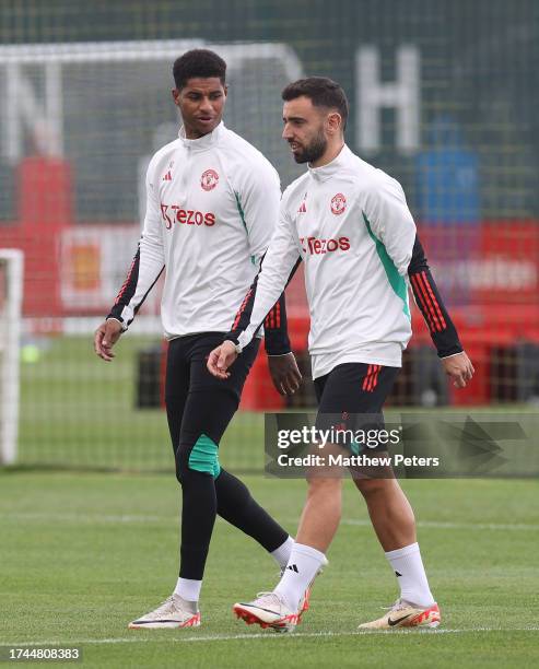 Marcus Rashford, Bruno Fernandes of Manchester United in action during a first team training session at Carrington Training Ground on October 19,...