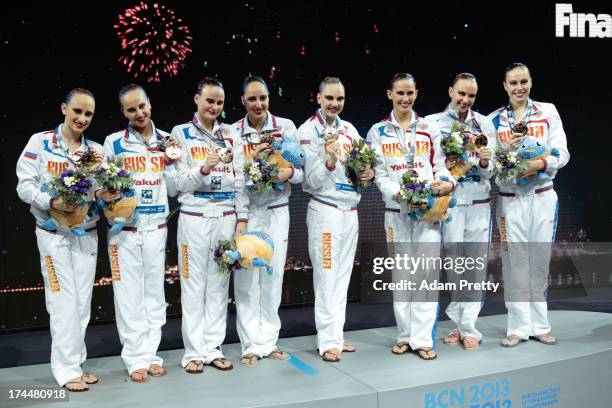 Gold medal winners Russia celebrate on the podium after the Synchronized Swimming Team Free Final on day seven of the 15th FINA World Championships...