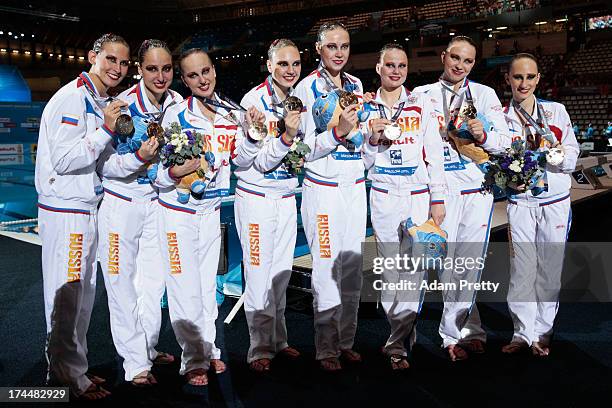 Gold medal winners Russia celebrate after the Synchronized Swimming Team Free Final on day seven of the 15th FINA World Championships at Palau Sant...