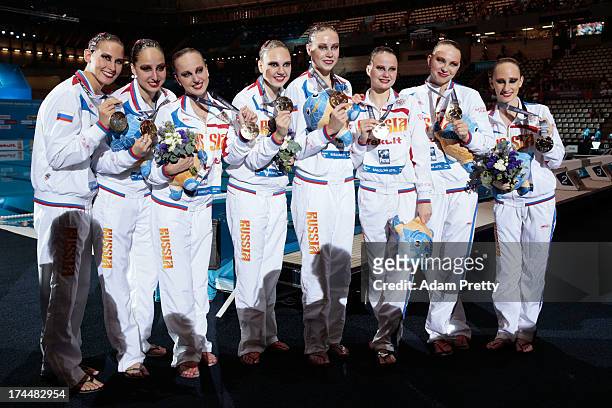 Gold medal winners Russia celebrate after the Synchronized Swimming Team Free Final on day seven of the 15th FINA World Championships at Palau Sant...