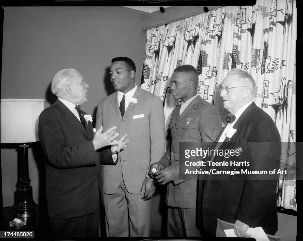 Pennsylvania Governor David L. Lawrence, Cleveland Browns football player Jim Brown, Pittsburgh Pirates baseball player Roberto Clemente, and...