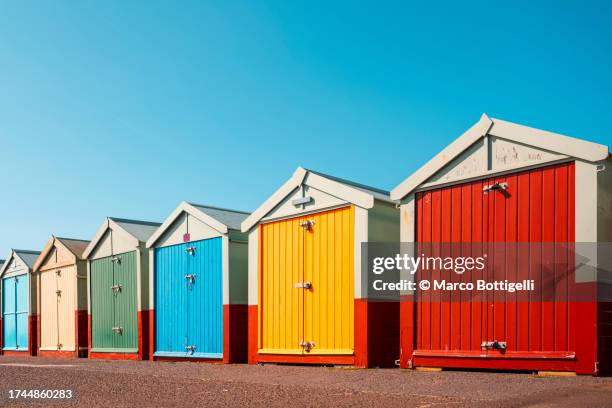 colorful beach huts, brighton, uk - brighton races stock pictures, royalty-free photos & images