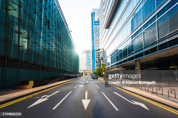 empty street in canary wharf, london, uk - eu road sign stock pictures, royalty-free photos & images