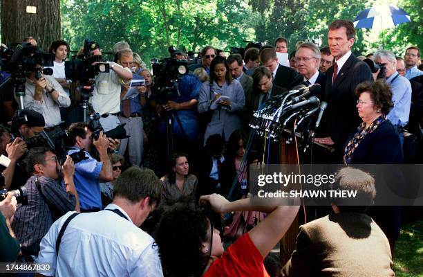 Senate Minority Leader Tom Daschle , joined by US Senators Harry Reid , Assistant Democratic Leader, and Barbara Mikulski , answer questions during a...