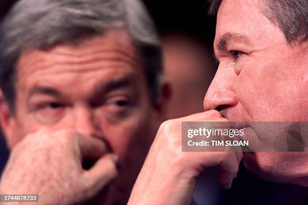 Attorney General-designate John D. Ashcroft joined by Senator Christopher Bond waits to testify during his US Senate confirmation hearing in the Hart...