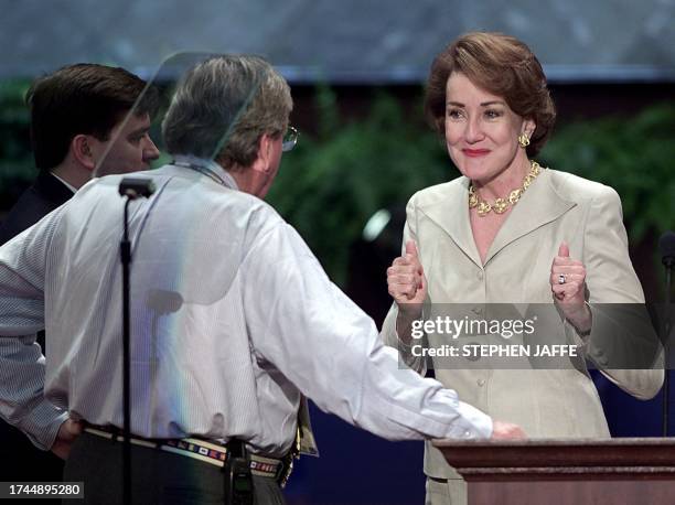 Elizabeth Dole takes some direction from several stage hand during a dress rehearsal at the Republican National Convention 01 August in Philadelphia,...