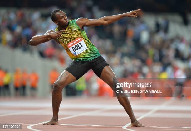 Jamaican sprinter Usain Bolt strikes his trademark pose as he celebrates after winning the men's 100 metres event during the London Anniversary Games...