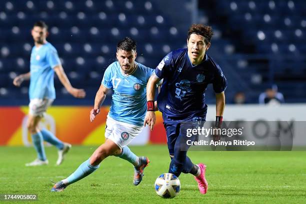 Minhyeok Kim of Buriram United controls the ball under pressure of Lefteris Antonis of Melbourne City FC during the AFC Champions League Group H...