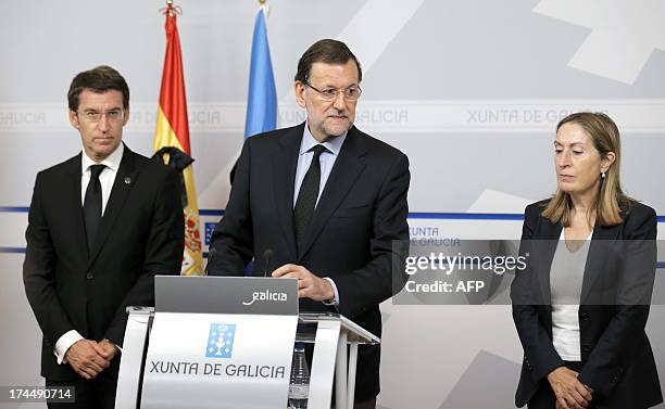 Spain's Prime Minister Mariano Rajoy , Galicia's regional President Alberto Nunez Feijoo and Spain's Minister of Development Ana Pastor give a press...