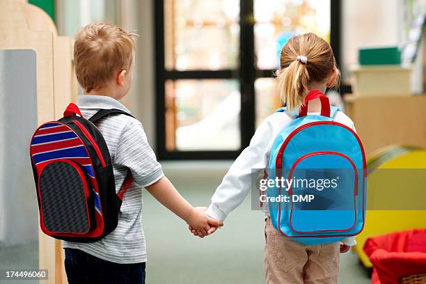 young children walking to school - school boy with bag stock pictures, royalty-free photos & images