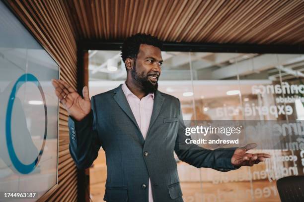 portrait of a man showing results - sales pitch stock pictures, royalty-free photos & images