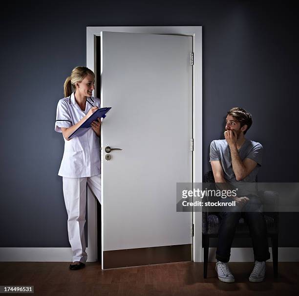 young man afraid of his medical exam - fear of writing stock pictures, royalty-free photos & images