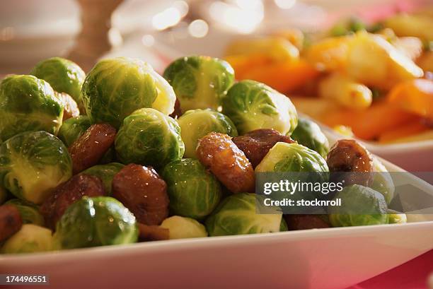 brussel sprouts - bowls of side dishes roast fotografías e imágenes de stock