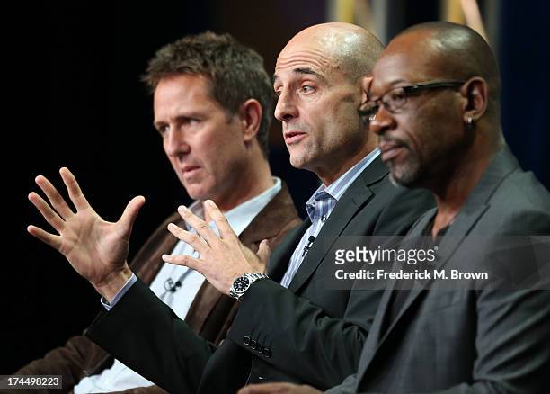 Executive Producer Chris Mundy and actors Mark Strong and Lennie James speak onstage during the "Low Winter Sun" panel discussion at the AMC portion...
