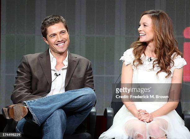 Actors Eric Winter and Rachel Boston speak onstage during the "Witches of East End" panel discussion at the Lifetime portion of the 2013 Summer...