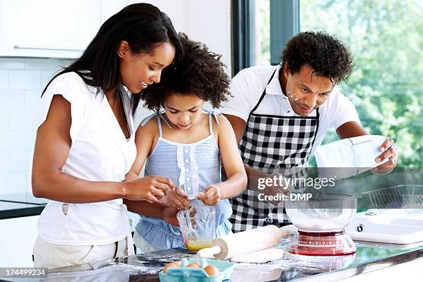 couple baking with daughter - mixing bowl stock pictures, royalty-free photos & images