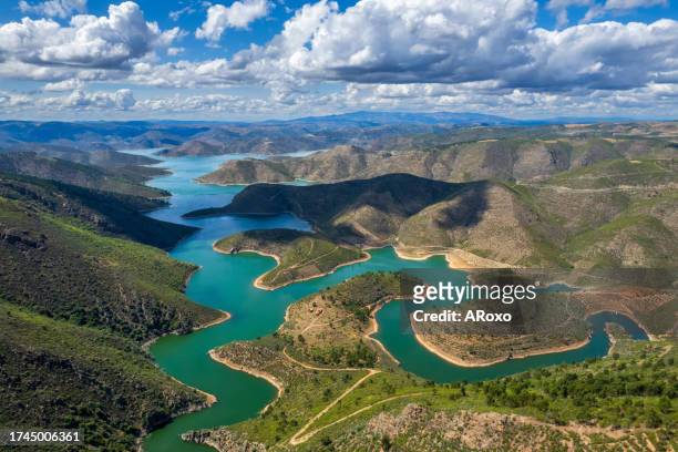 abstract landscape of sabor lake, tras os montes and alto douro, portugal. drone vision, aerial view of serpente do medal, sabor river, tourist attraction and travel destination in northern portugal. - douro river stockfoto's en -beelden