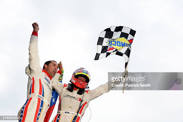 Drivers Alex Popow and Ryan Dalzie of the Starworks with Alex Popow Soloson BMW Riley celebrate after winning the Grand-Am Rolex Sports Car Series...