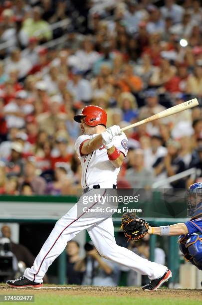 Ryan Zimmerman of the Washington Nationals hits the game-winning home run in the ninth inning against the New York Mets at Nationals Park on July 26,...