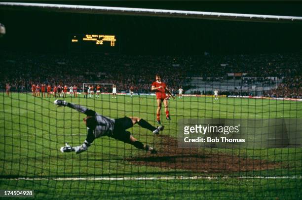 Midfielder Graeme Souness beats Roma goalkeeper Franco Tancredi to score Liverpool's second penalty in the shoot-out following a 1-1 draw after extra...