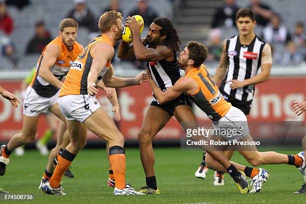 Harry O'Brien of the Magpies is tackled during the round 18 AFL match between the Collingwood Magpies and the Greater Western Sydney Giants at...