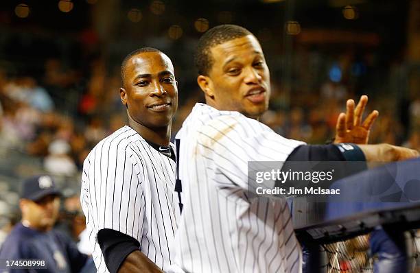 Alfonso Soriano and Robinson Cano of the New York Yankees look on against the Tampa Bay Rays at Yankee Stadium on July 26, 2013 in the Bronx borough...