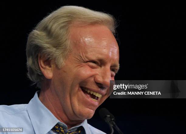 Democratic presidential hopeful, Connecticut Senator Joe Lieberman, laughs as he delivers his remarks at the political action conference of the...