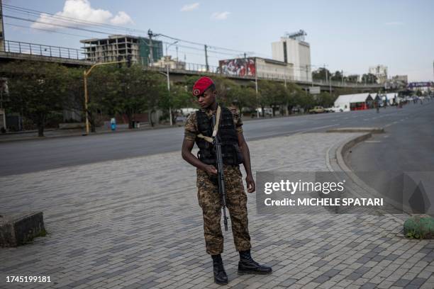 Soldier of the Ethiopian National Defense Force stands guard on the perimeter of a closed off Meskel Square in Addis Ababa on October 25 the day...